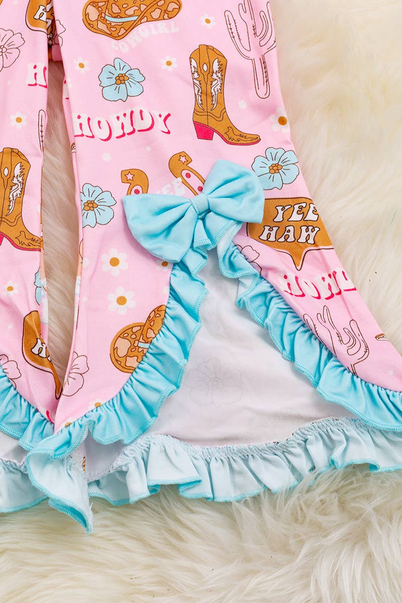HOWDY" COWGIRL ROMPER WITH BOW DETAIL.