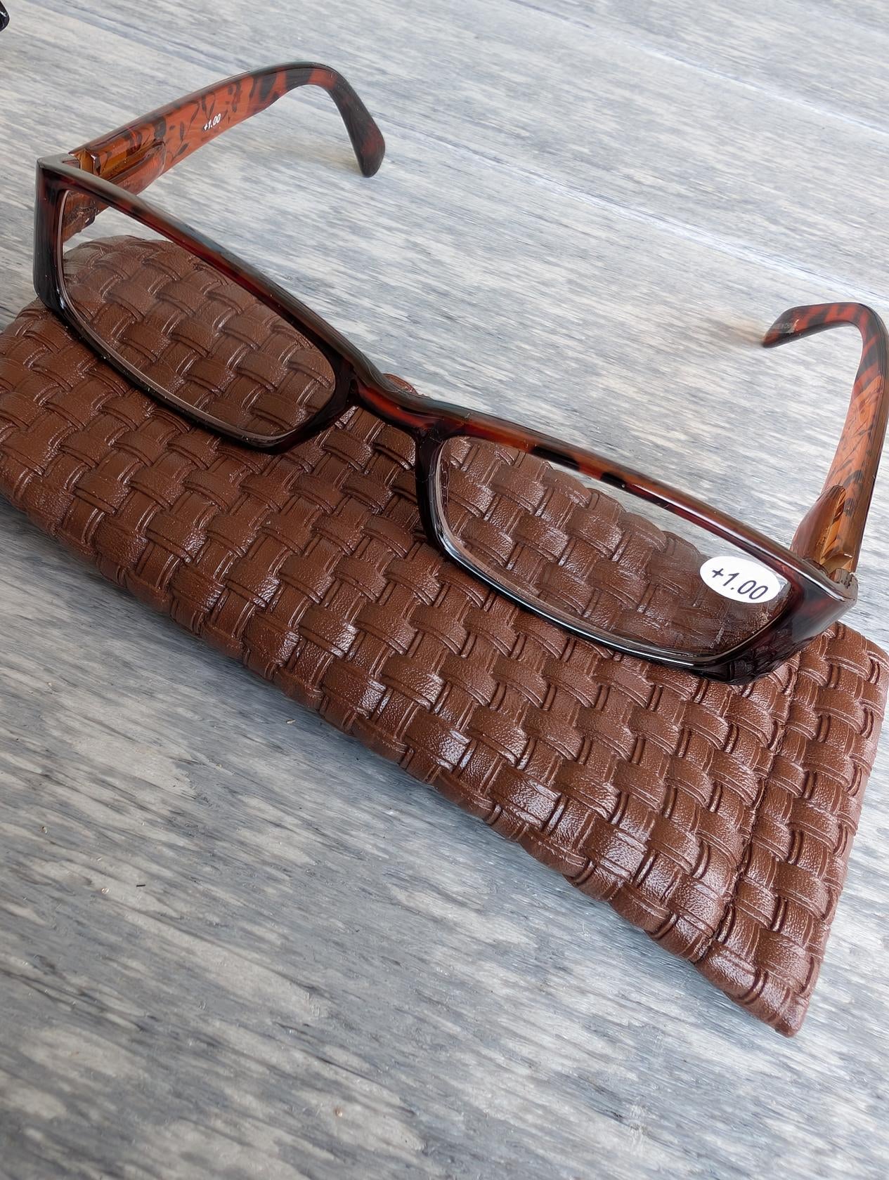 "Fashionable reading glasses in assorted colors with matching case"