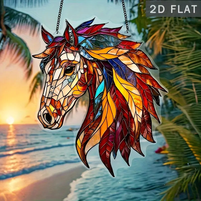 Colorful stained glass horse head hanging ornament with a beach background