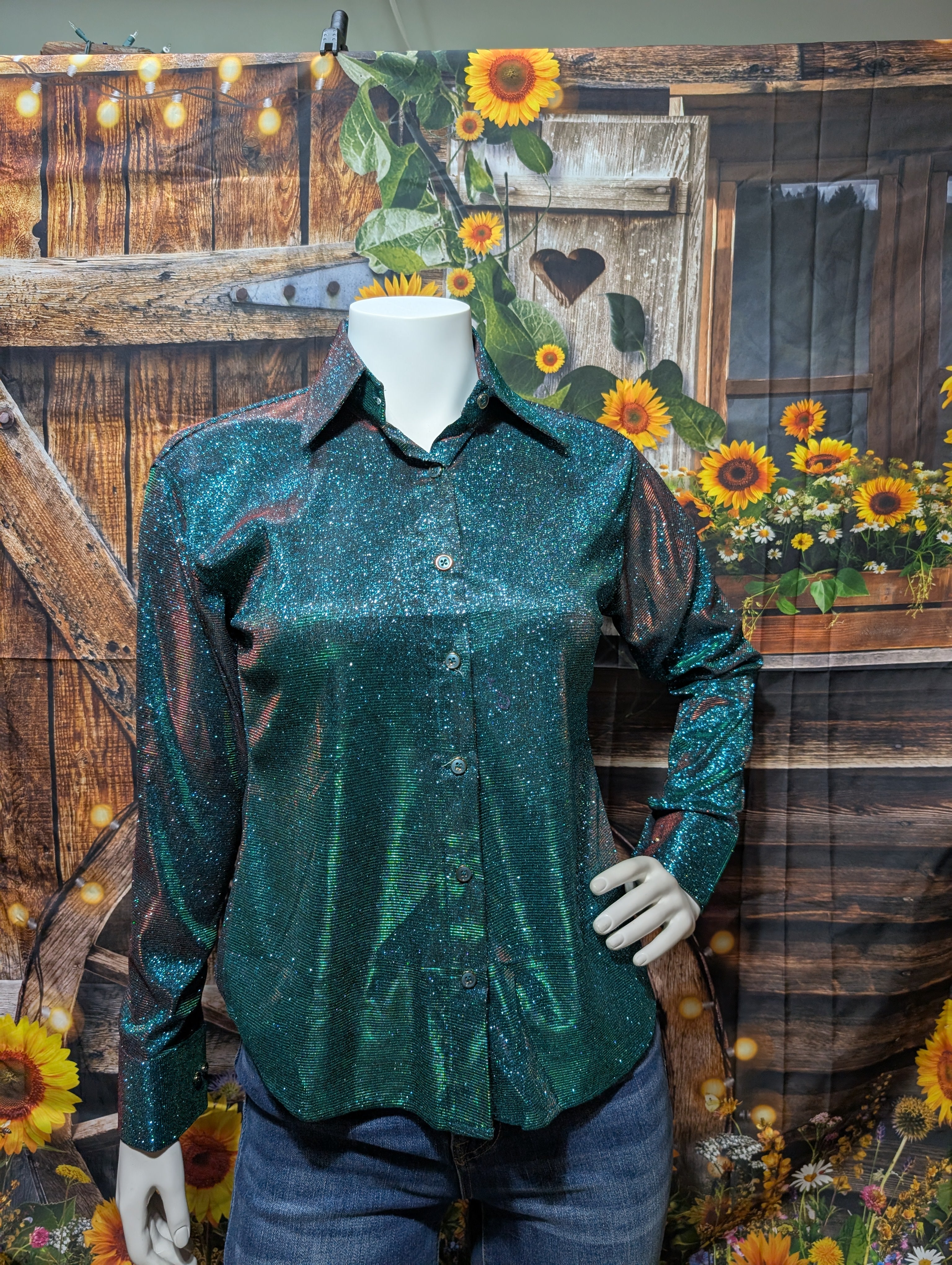 Rider wearing green sparkly show shirt and black hat, ready to compete in Western showmanship.