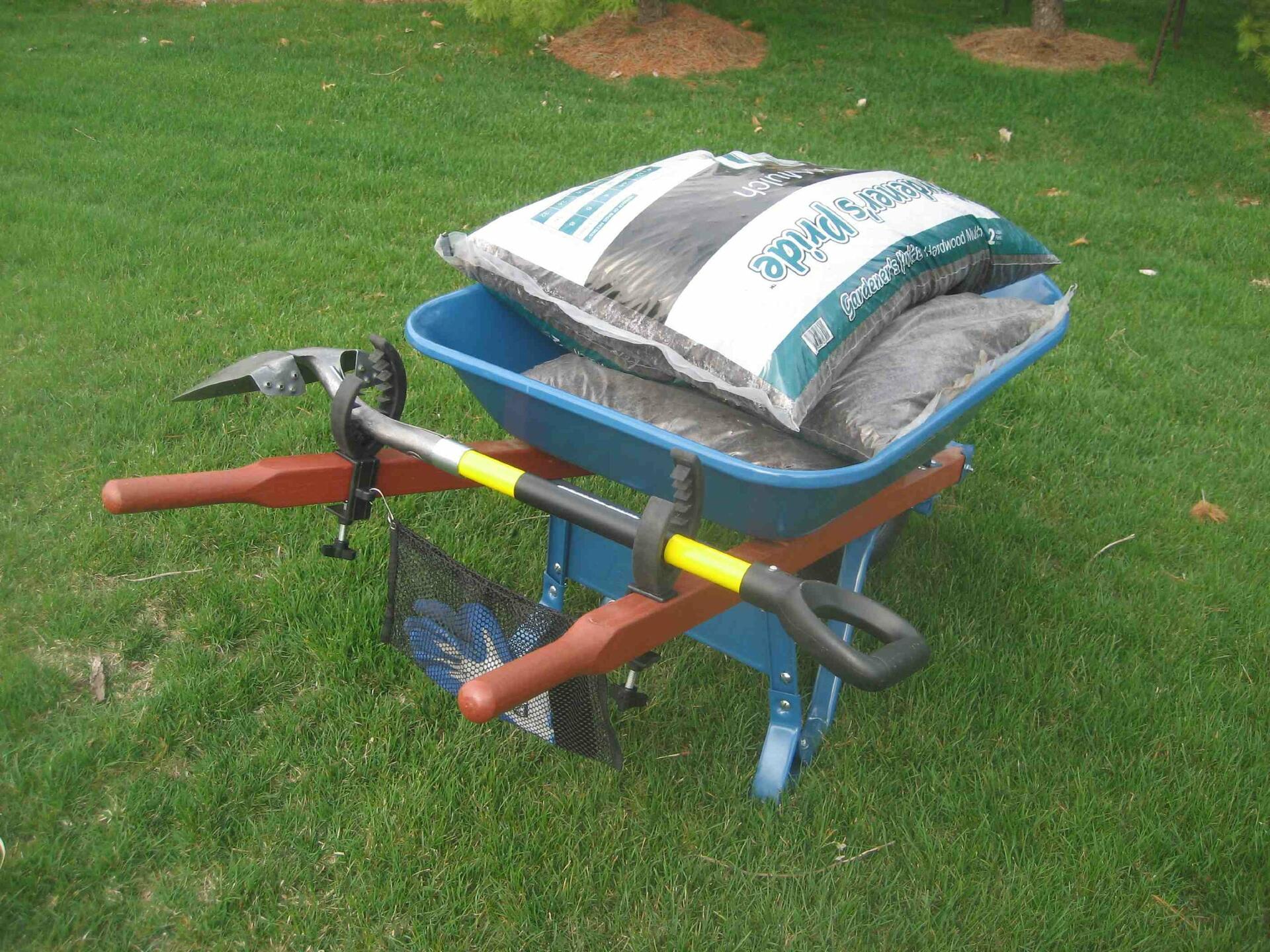 Grizzly Grip tool holder with mesh bag attached to a wheelbarrow for secure tool storage