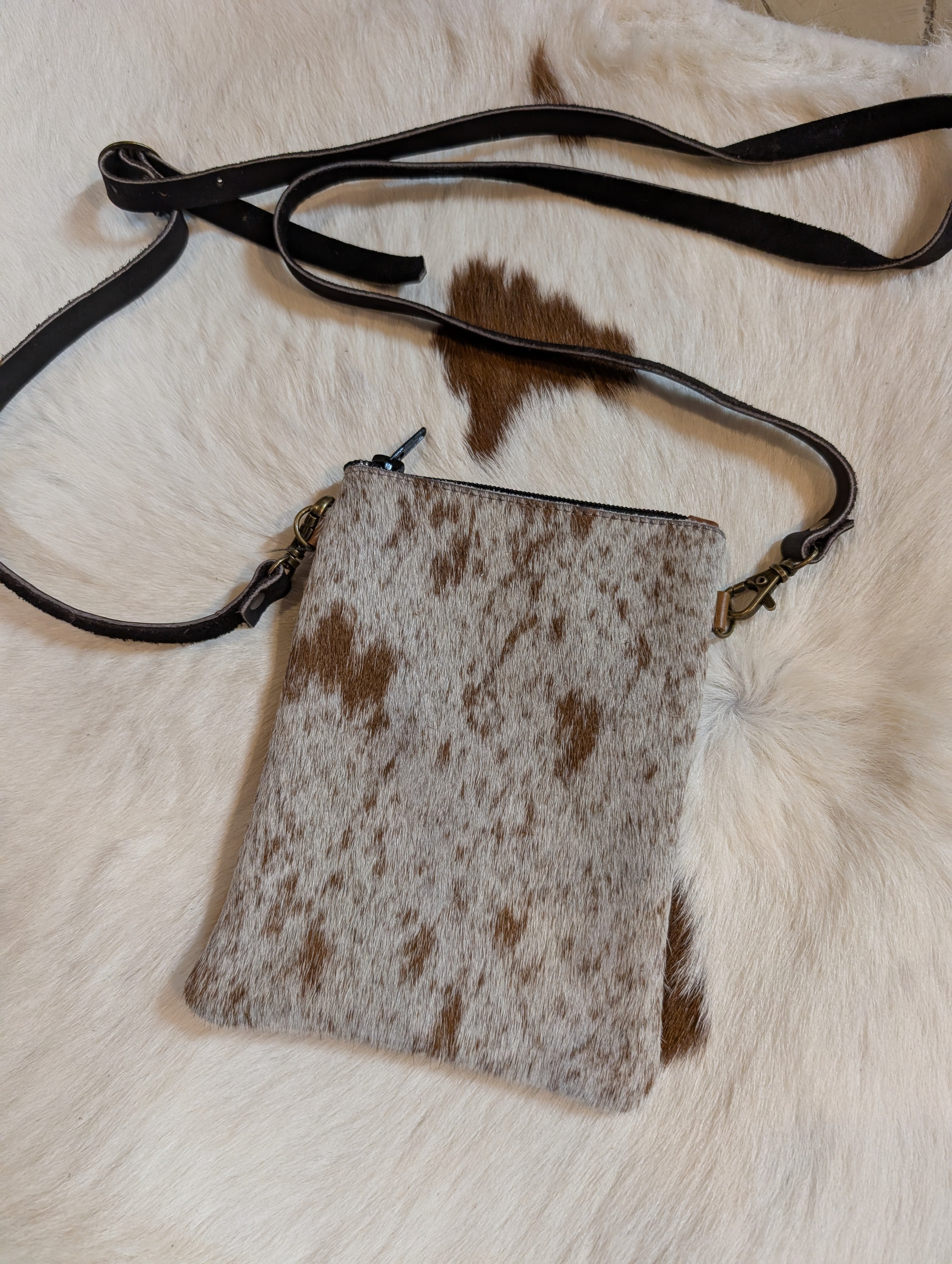 Minimalist rustic style genuine leather crossbody purse with adjustable strap, perfect for western outfits.