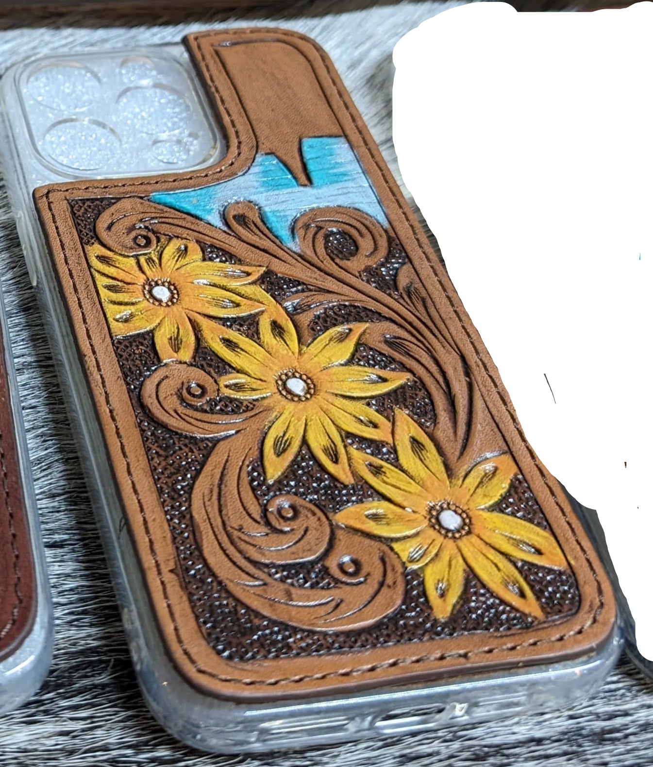 Phone case with floral design and colorful geometric pattern on a textured surface