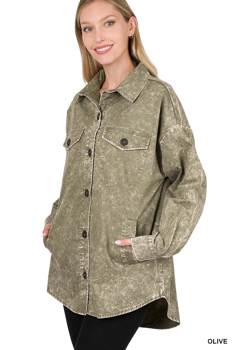 Woman wearing an olive green jacket with a white background
