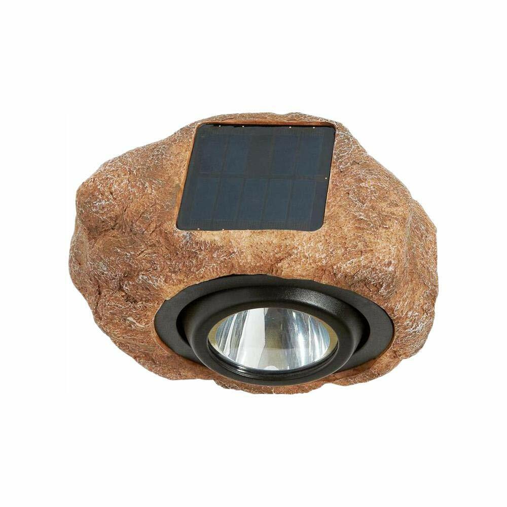 Solar-powered rock-shaped outdoor light with a visible solar panel on a white background