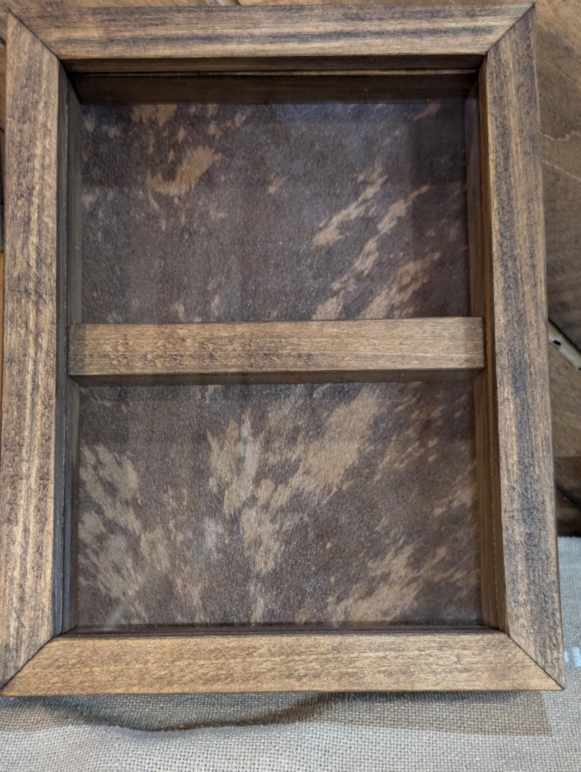"Handcrafted solid wood trophy buckle case with genuine cowhide background and two display compartments – rustic and custom-made"