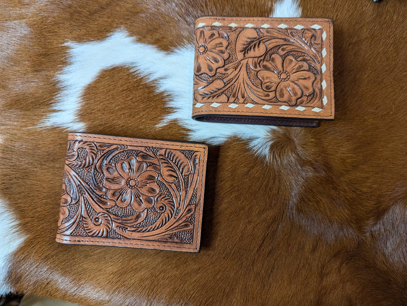 Men's Leather Wallets on a cowhide rug.