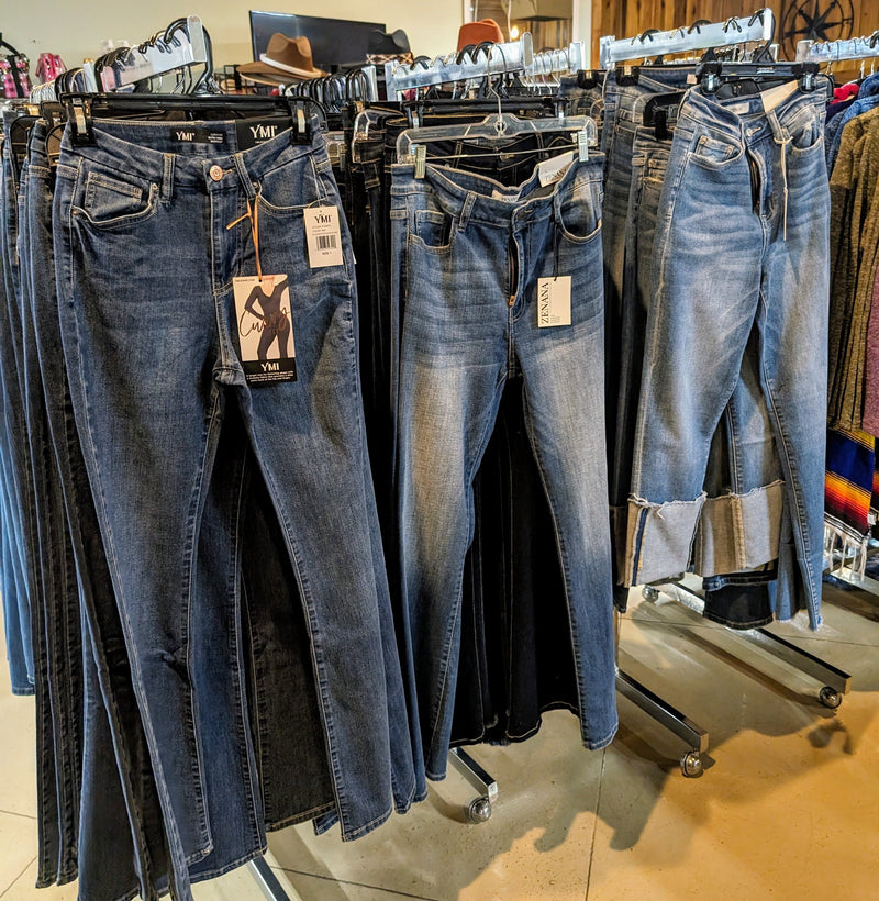 Women jeans hanging on a clothes rack in a store
