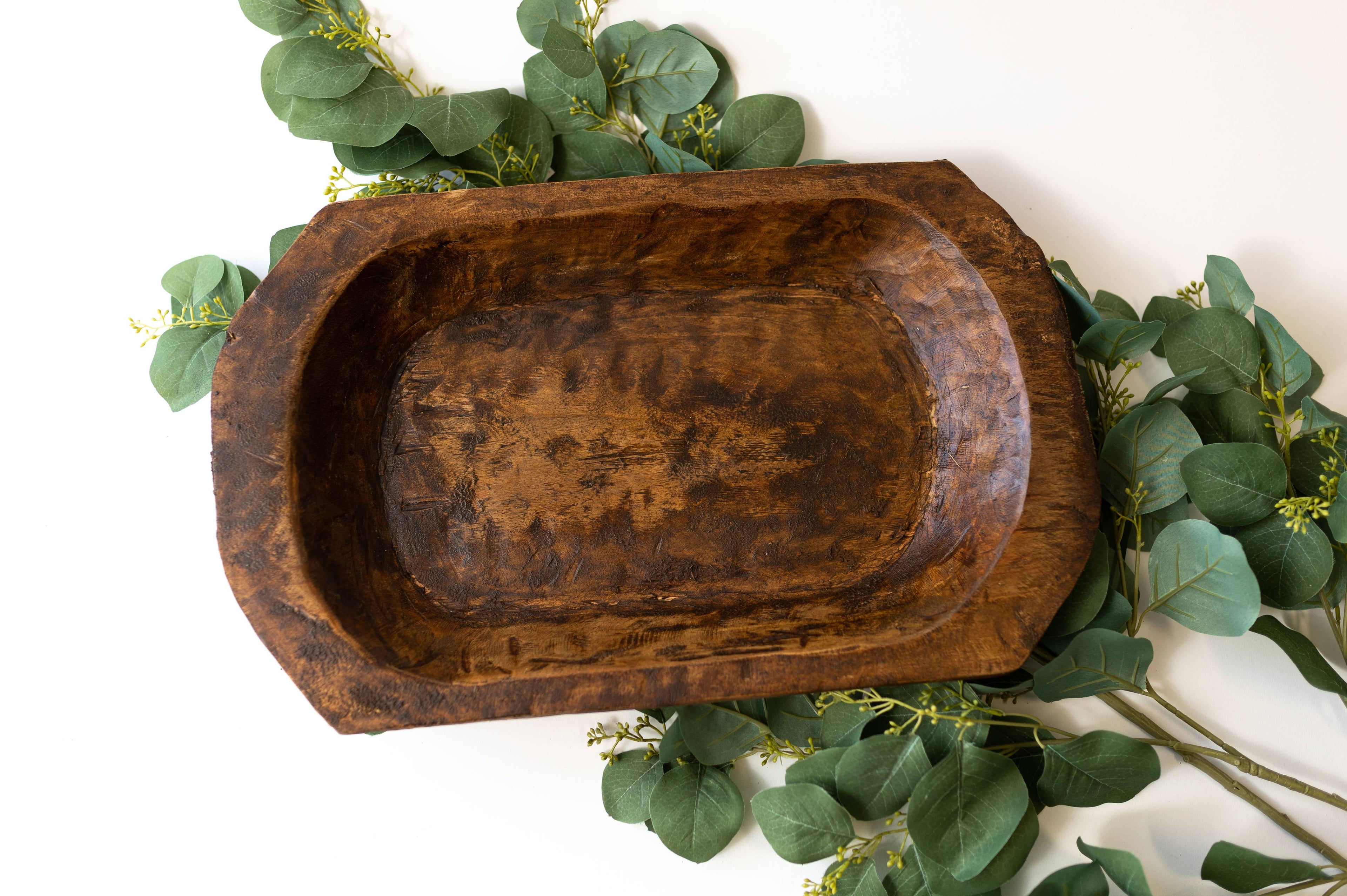 Bohemian wood accent bowl on wooden shelf