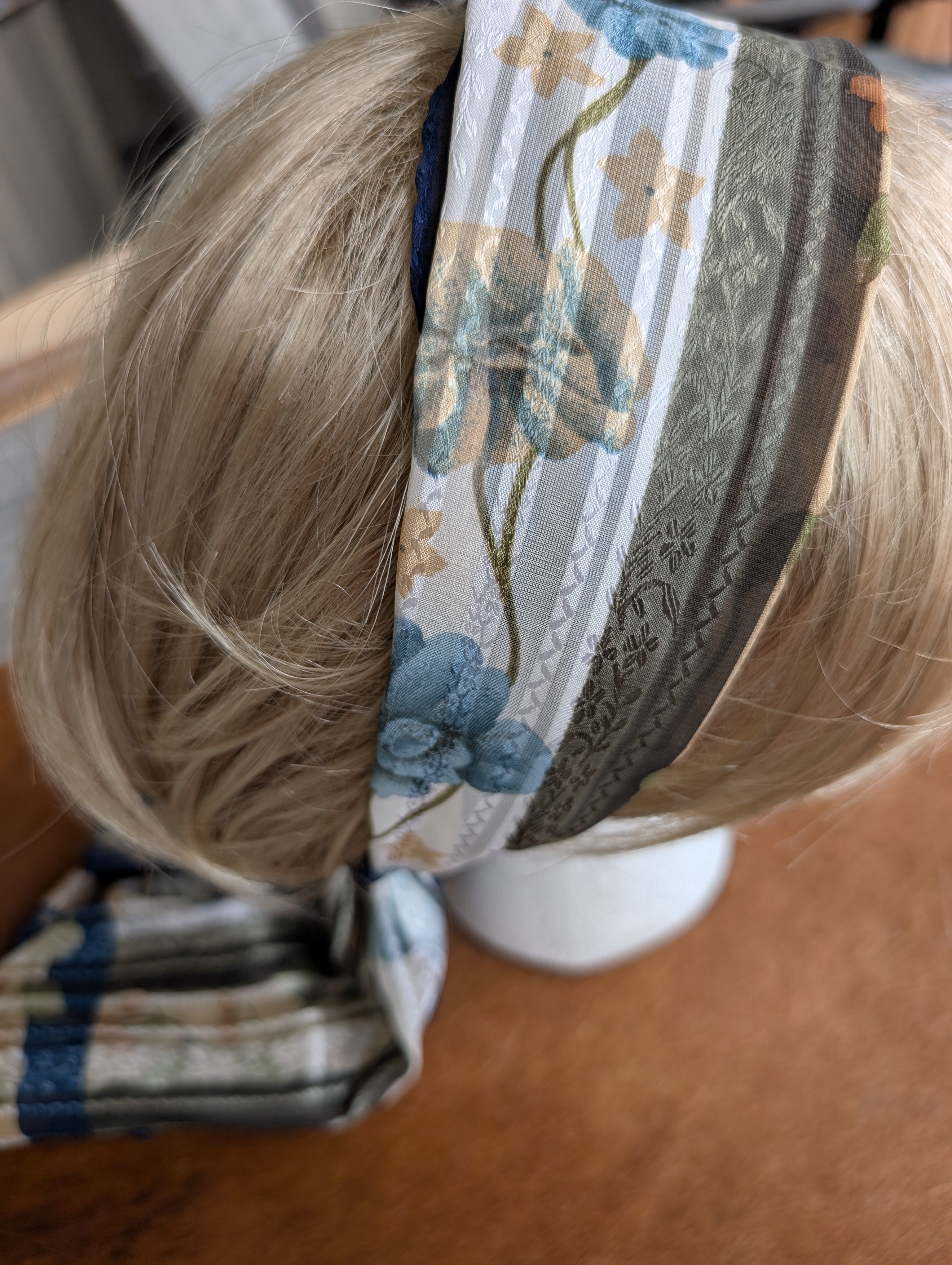 "Versatile designer wrap for hair, neck, or bag"