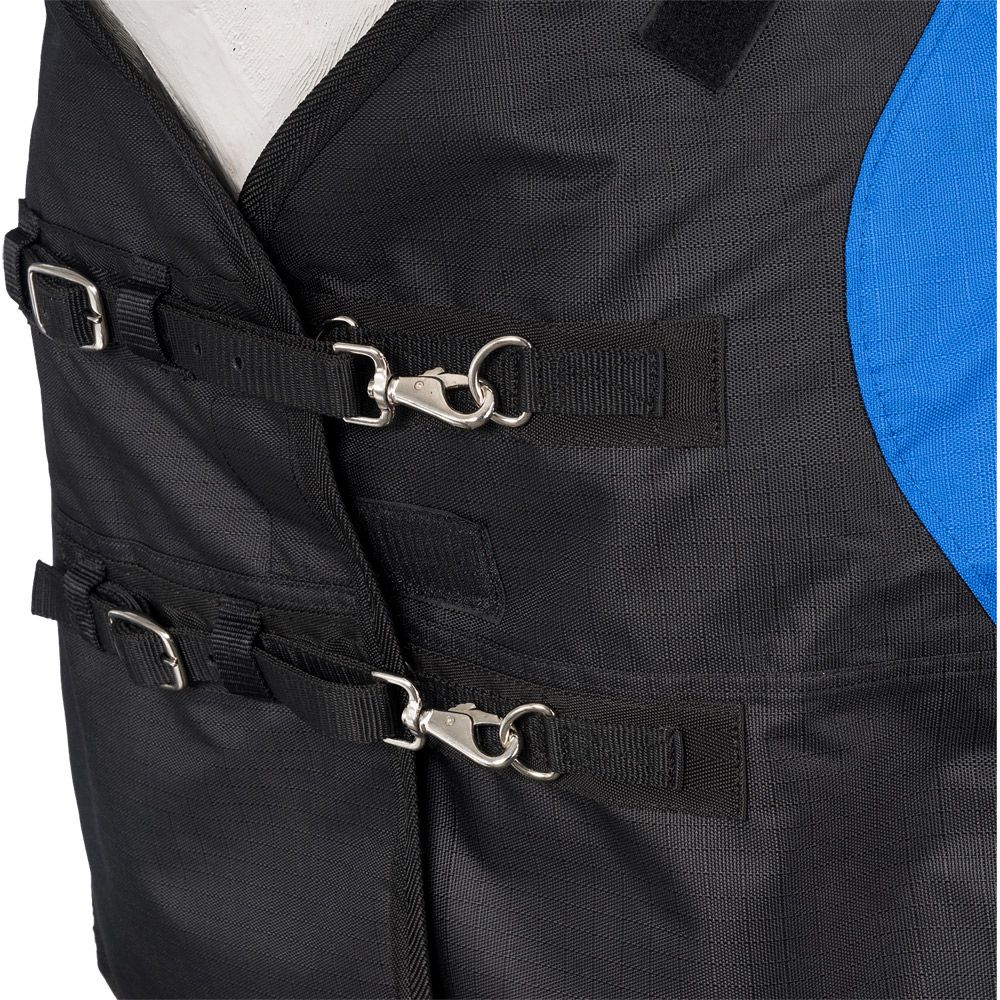 Close-up of double-buckle front chest closure with metal trigger snaps and adjustable straps on a black and blue horse turnout sheet