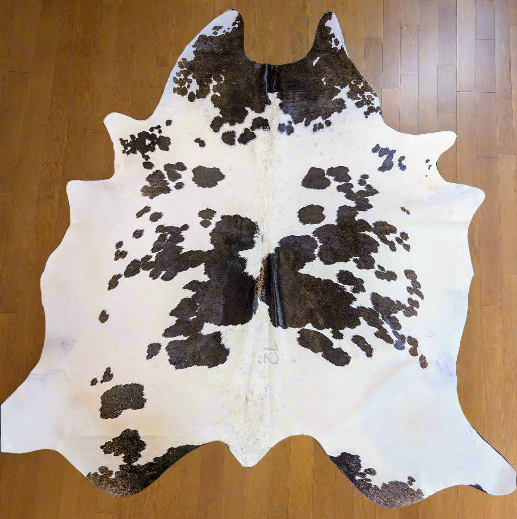 Authentic brown and white cowhide rug – real Grade A leather hide for rustic or Western-style home decor