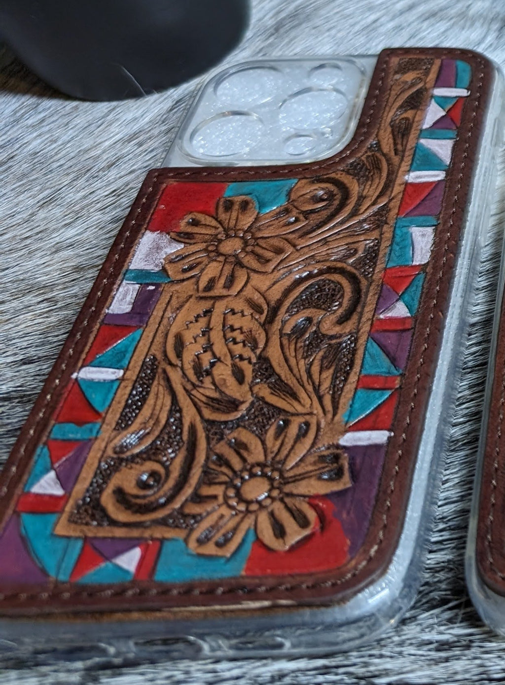 phone case with intricate designs on a textured surface