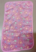 Pink mat with colorful heart pattern on a light gray background