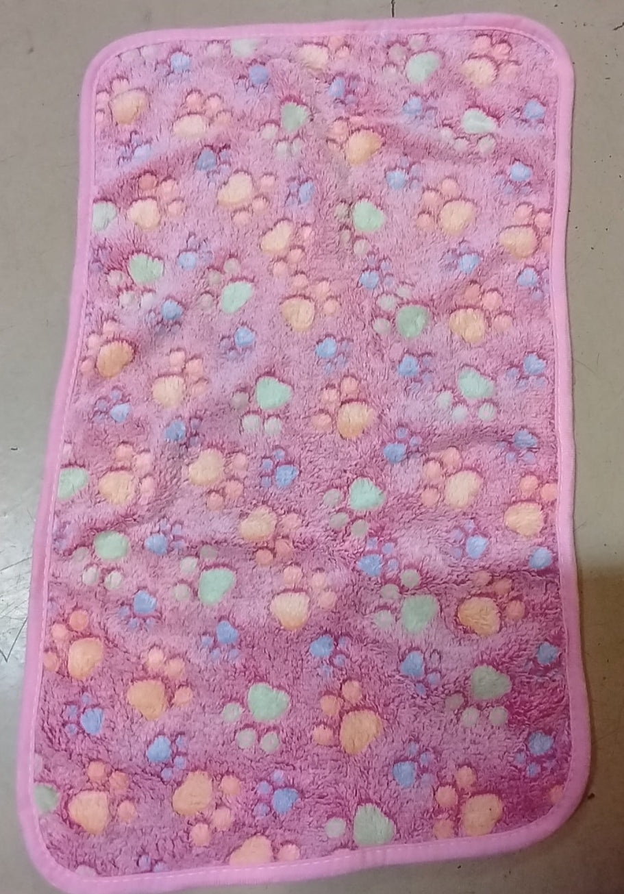 Pink mat with colorful heart pattern on a light gray background