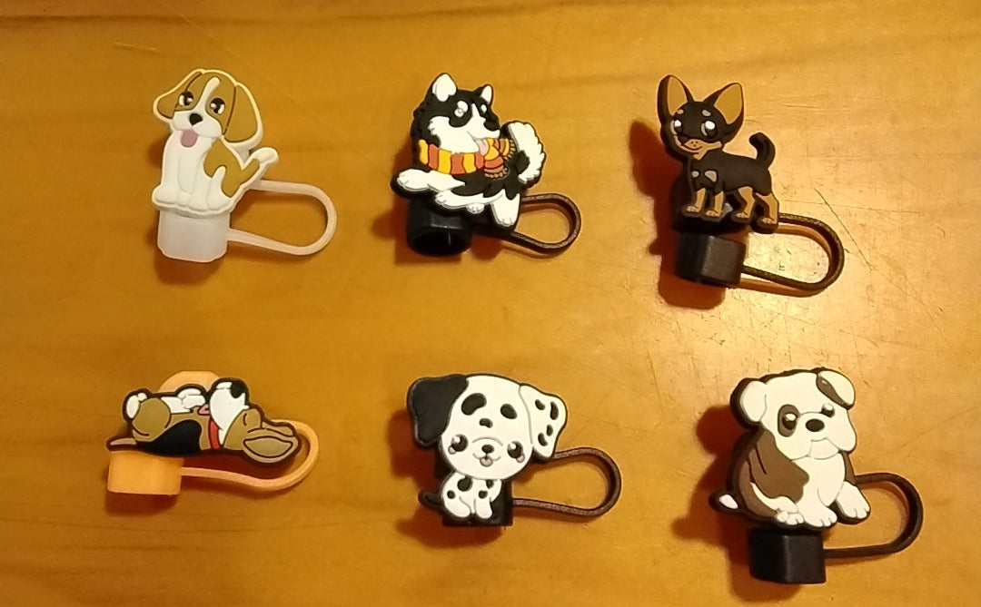 Set of six dog-themed phone clips on a wooden surface with 'WOOF' banner above.