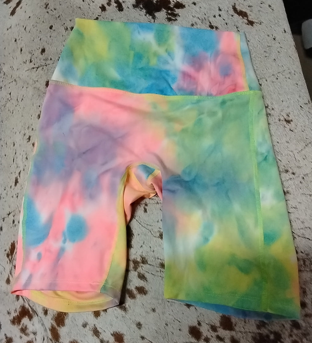 Tie-dye shorts on a textured surface