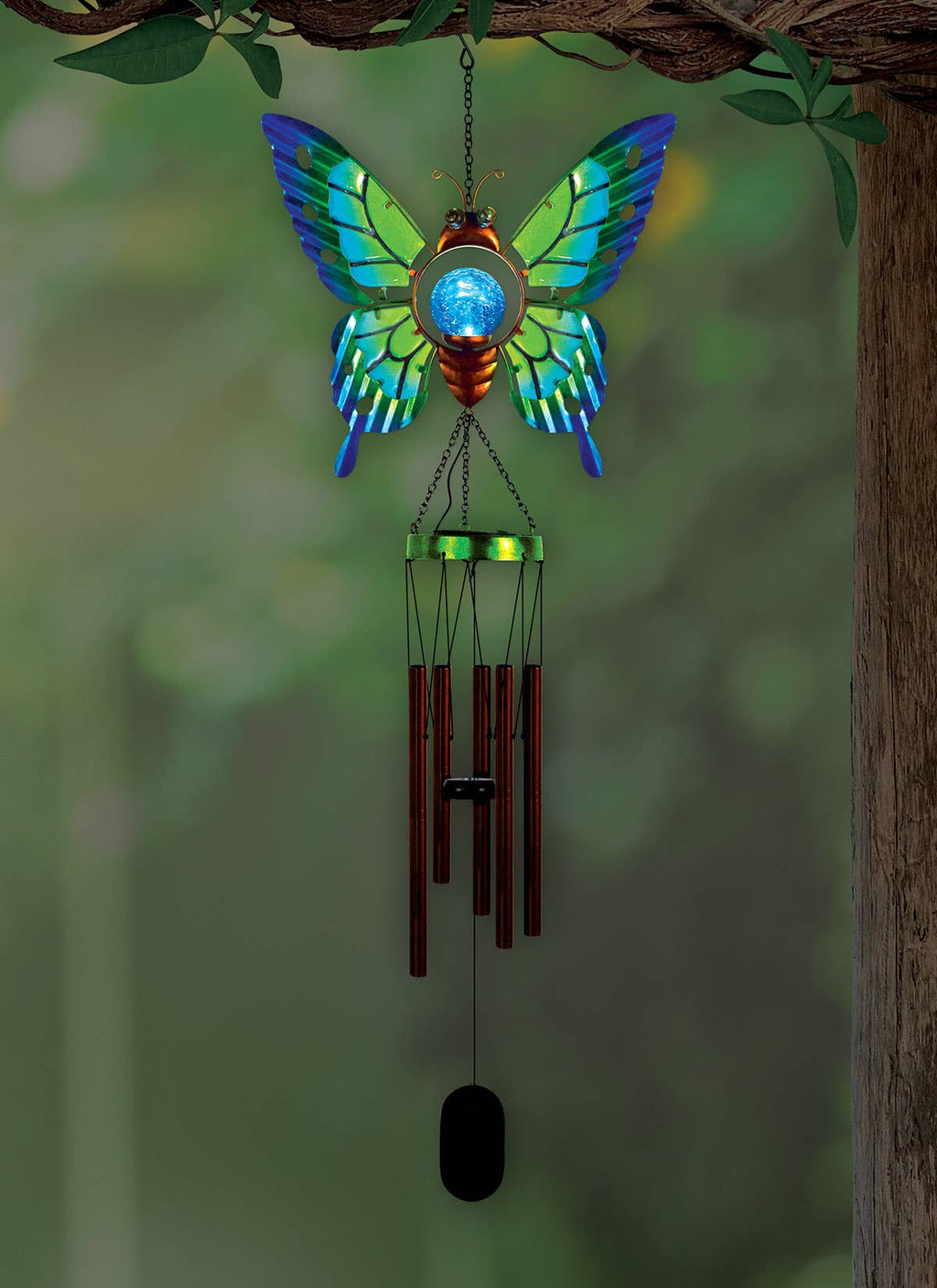 Butterfly-shaped wind chime with colorful wings against a natural background