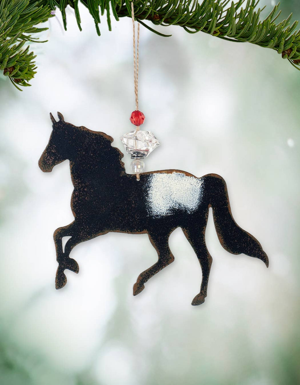 Horse-shaped ornament with a crystal and red gem 