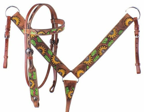 Brown leather horse bridle with sunflower pattern on a white background