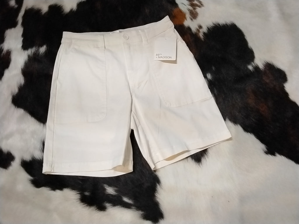 White tailored shorts mid-thigh front view