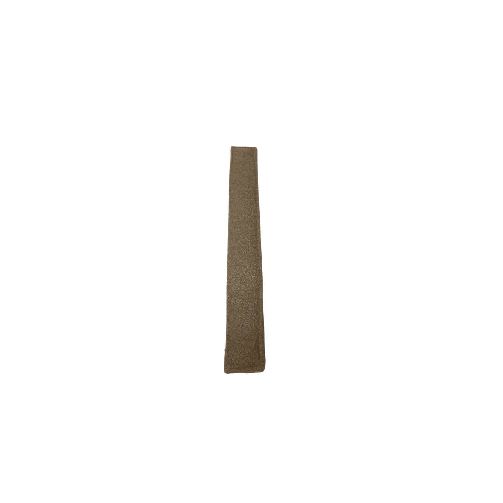 Long, narrow, brown object on a white background
