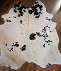 Authentic black and white cowhide with natural branding – large real cowhide rug or wall decor piece