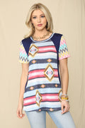 Women's Aztec print tunic top with short sleeves and round neck laid flat in Western-style pattern