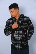 A person wearing a hooded jacket with Southwest jacquard designs in multicolor.