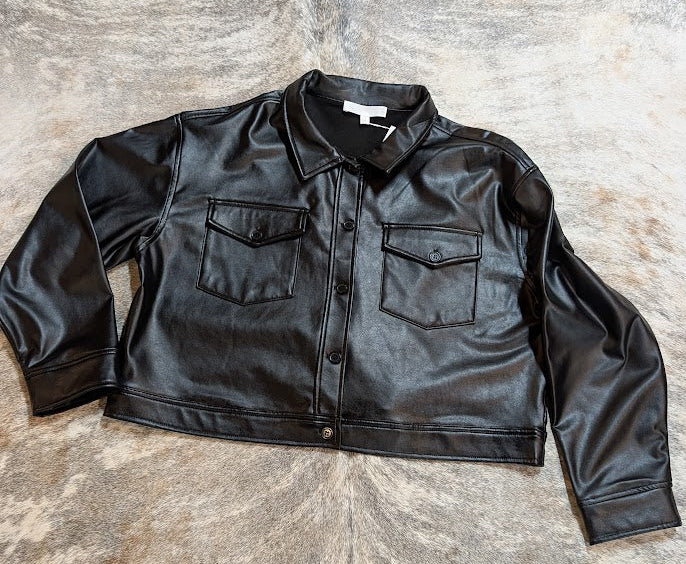 Black leather jacket on a brindle cowhide