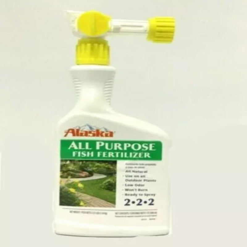 Front view of Alaska Fish Fertilizer 32 oz bottle with built-in hose sprayer for easy garden use.