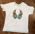 White graphic tee with angle wings and Dreamer with a textured background.