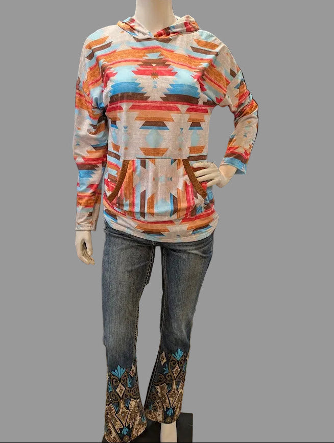 Mannequin wearing a colorful aztec hoodie and jeans with a gray background