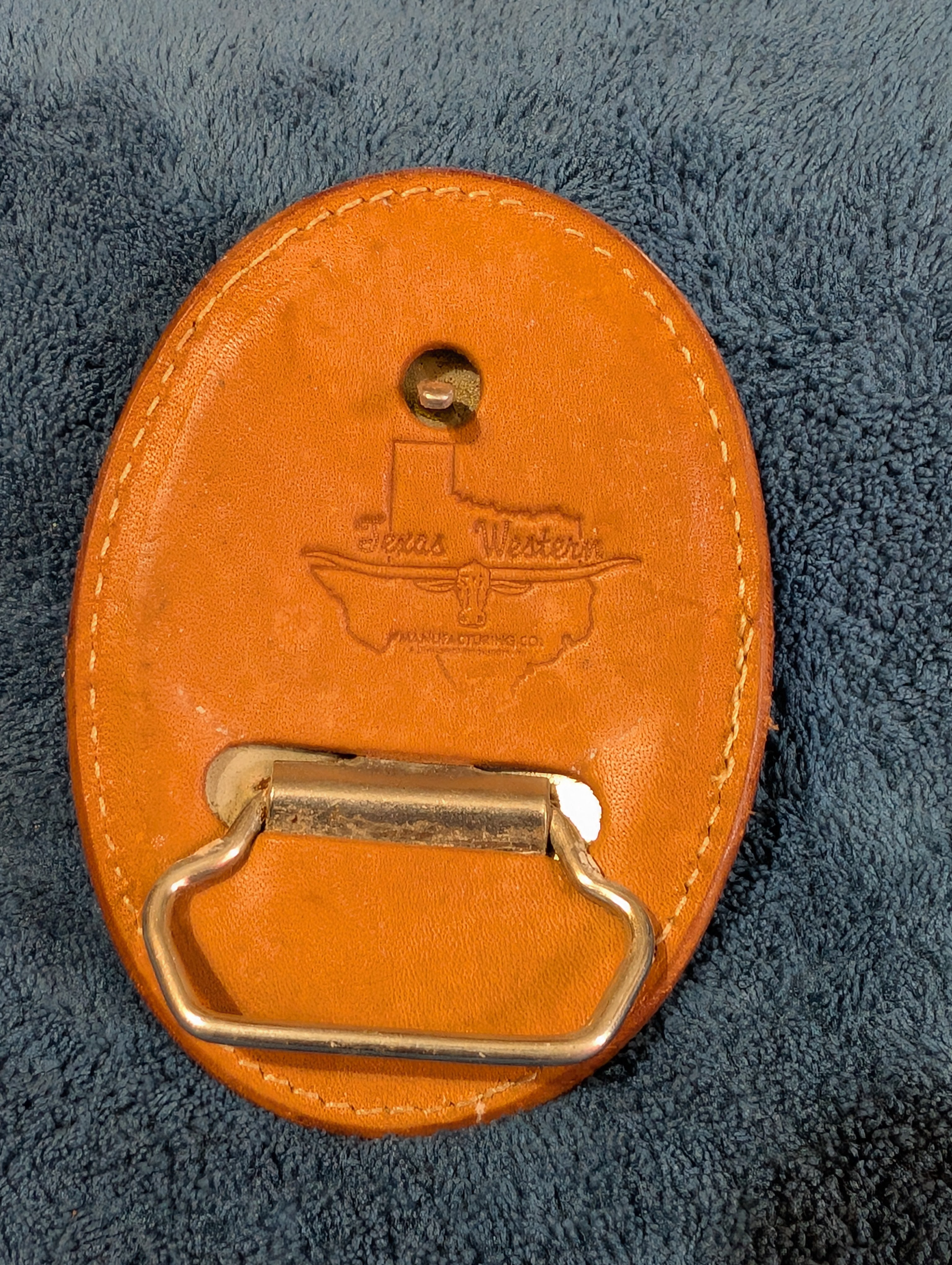 Back of a Leather belt buckle hand made in texas