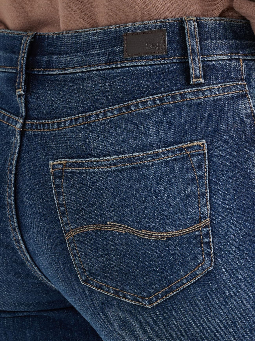 Lee Capri back pocket view on a lady with a brown shirt.