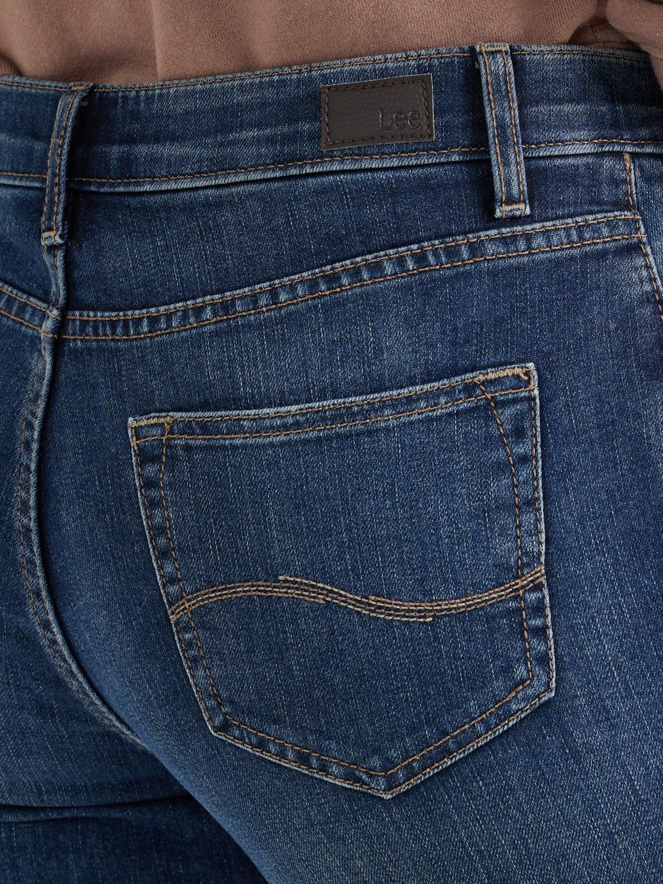 Lee Capri back pocket view on a lady with a brown shirt.