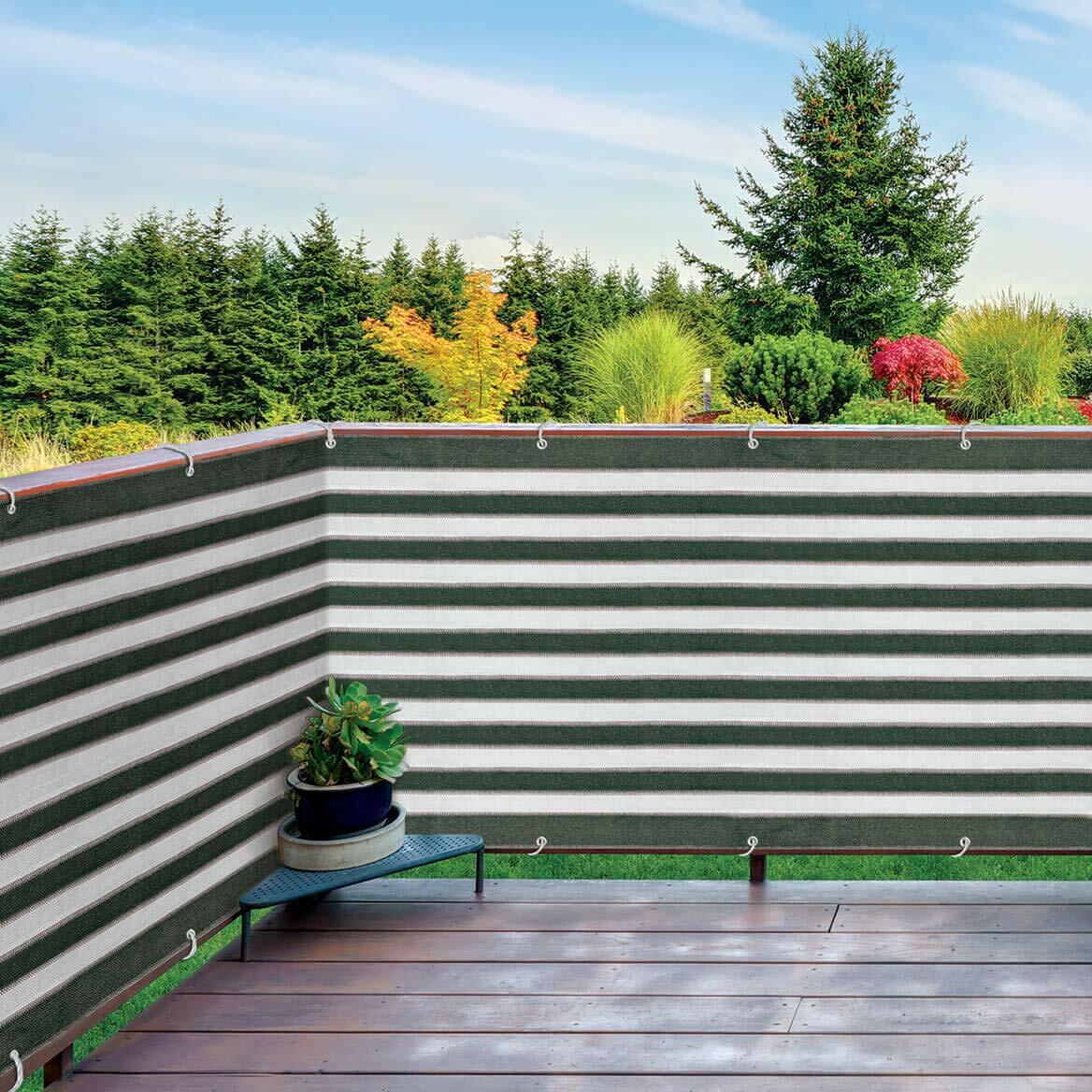 Backyard patio with Ideaworks privacy netting creating shade