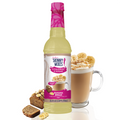 Jordan's Skinny Mixes banana bread syrup bottle with a glass of coffee and banana bread slices