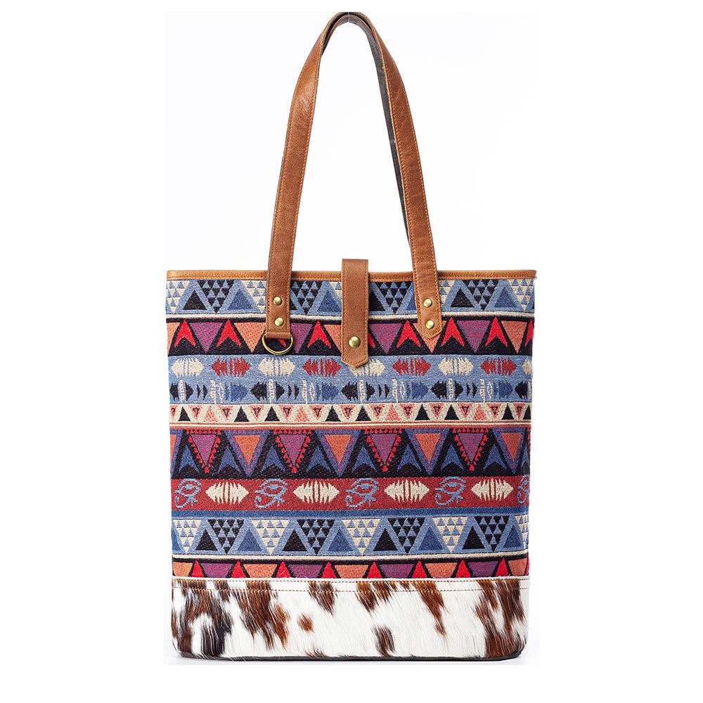 Tote bag with aztec pattern and cowhide design on a white background