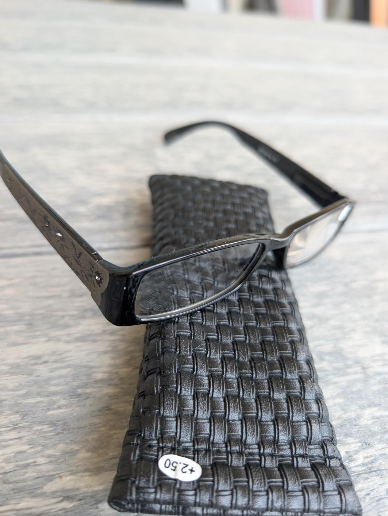 "Close-up of stylish reader glasses in four strengths"
