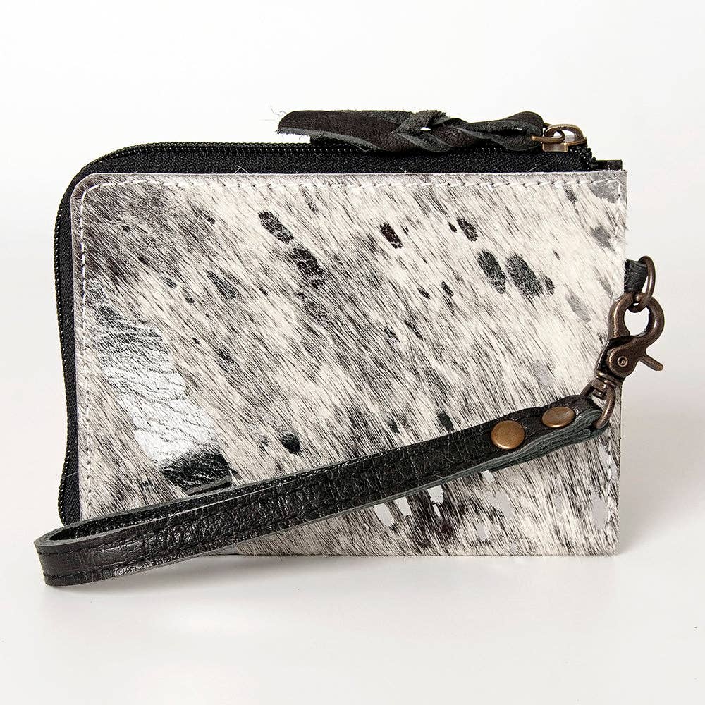 Wristlet with cowhide leather pattern on a white background