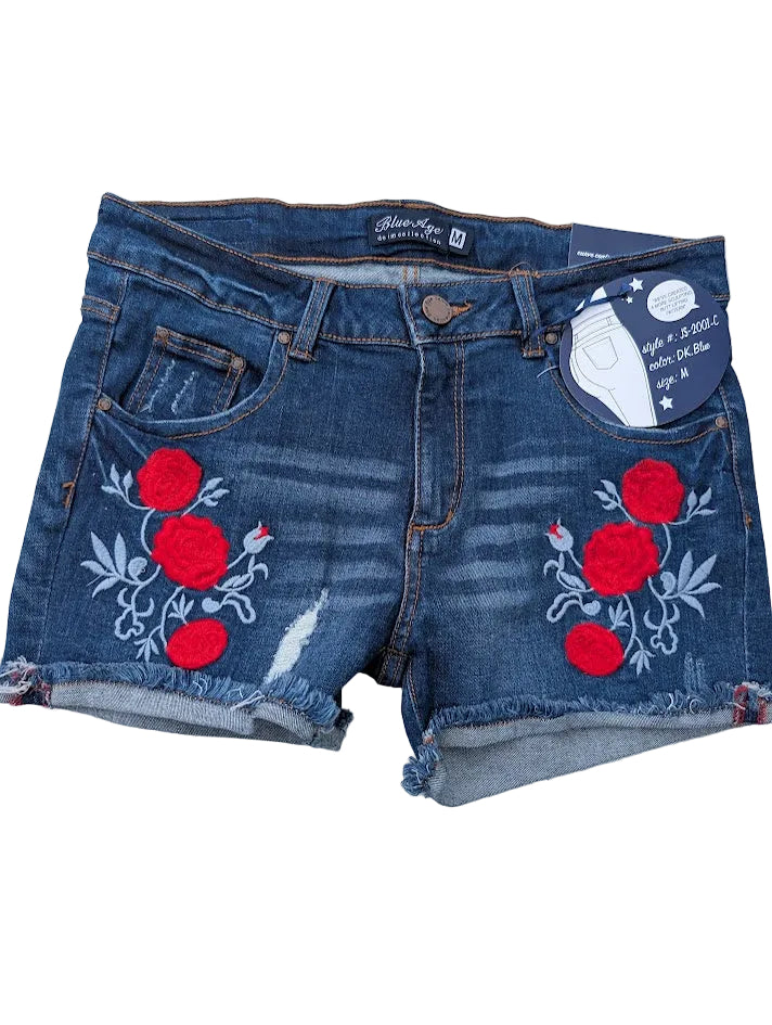 Blue denim shorts with red floral embroidery on a white surface