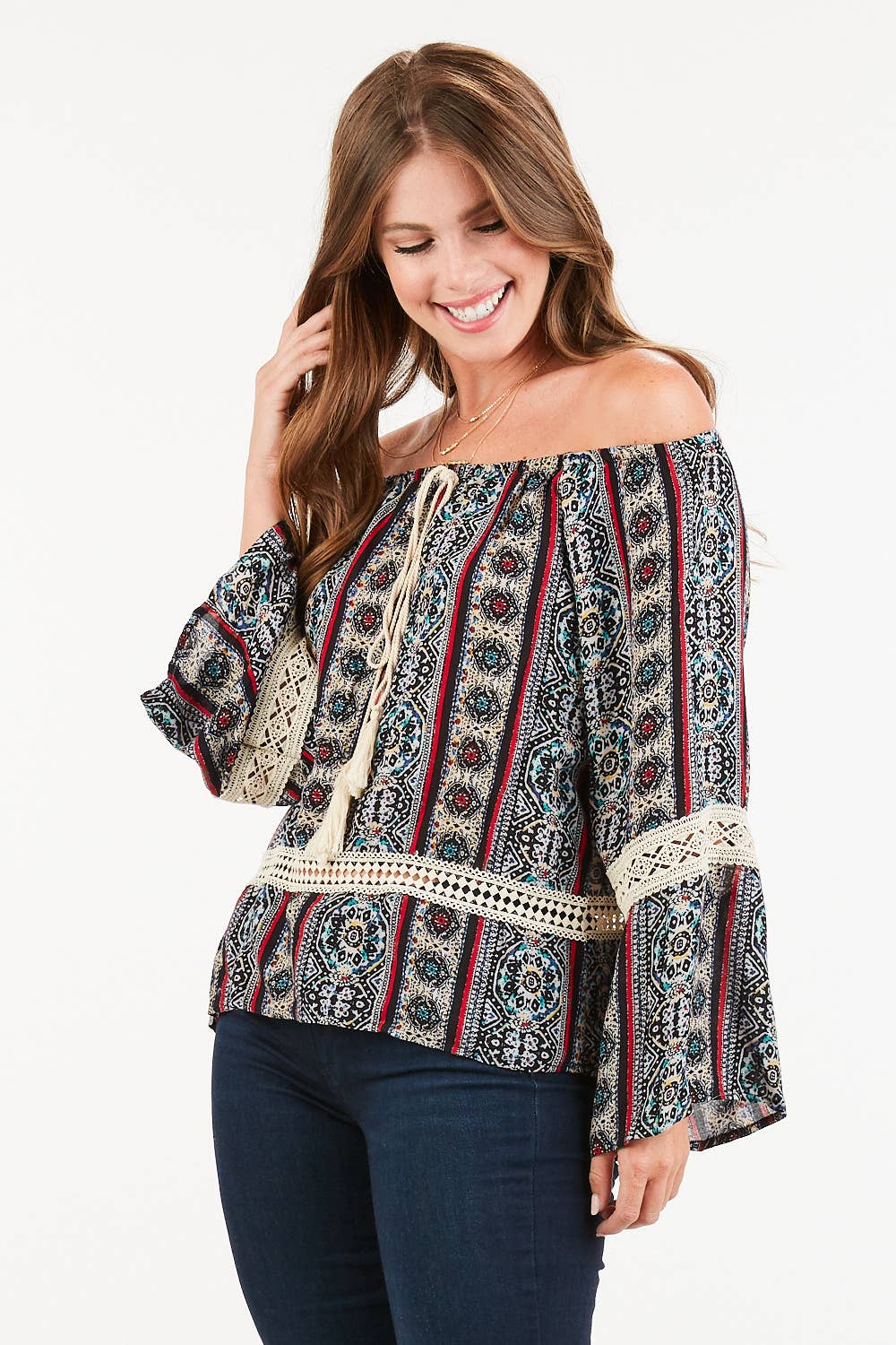 Flowy off-shoulder blouse with tassel accents and boho sleeves