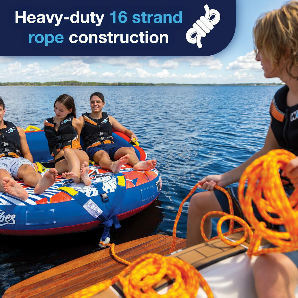 People on an inflatable tube with a person holding orange rope, against  water background.