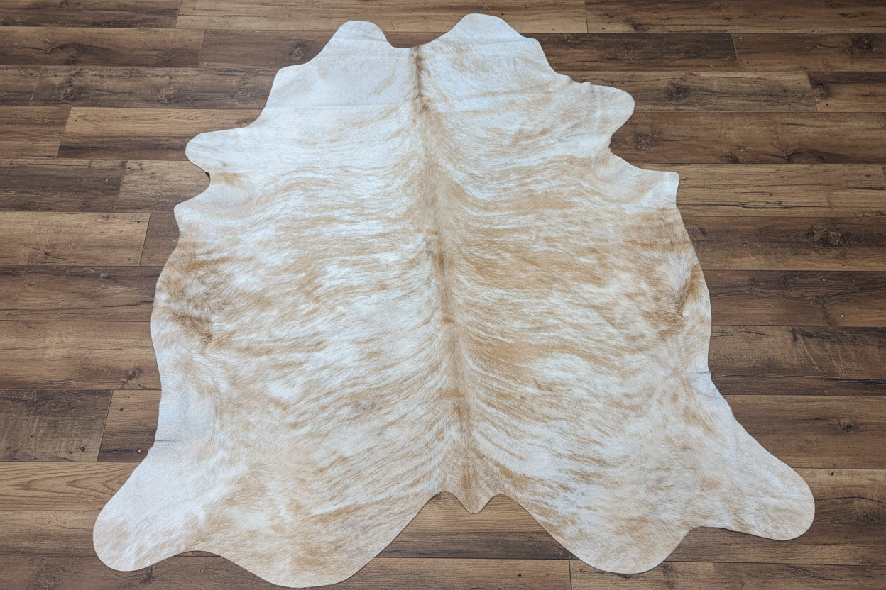 Cowhide rig on a rustic wood floor