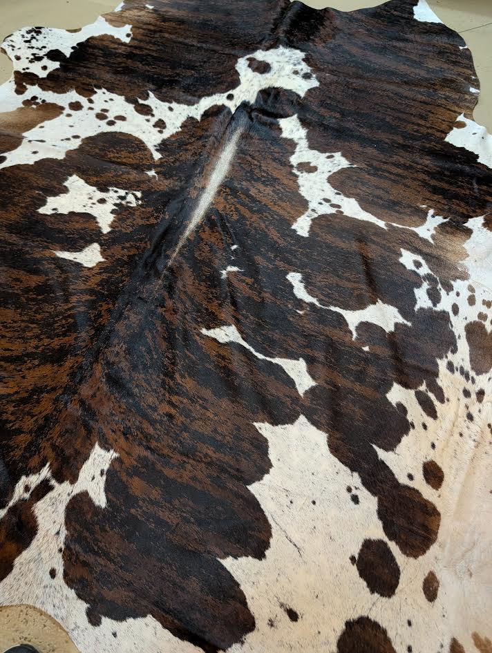 Close-up of a cowhide rug with brown and white pattern