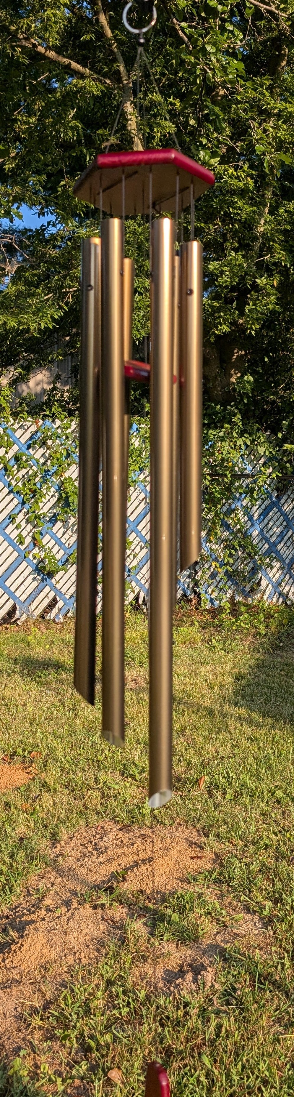 Country Side Products 70763 42-inch gold windchime hanging on porch