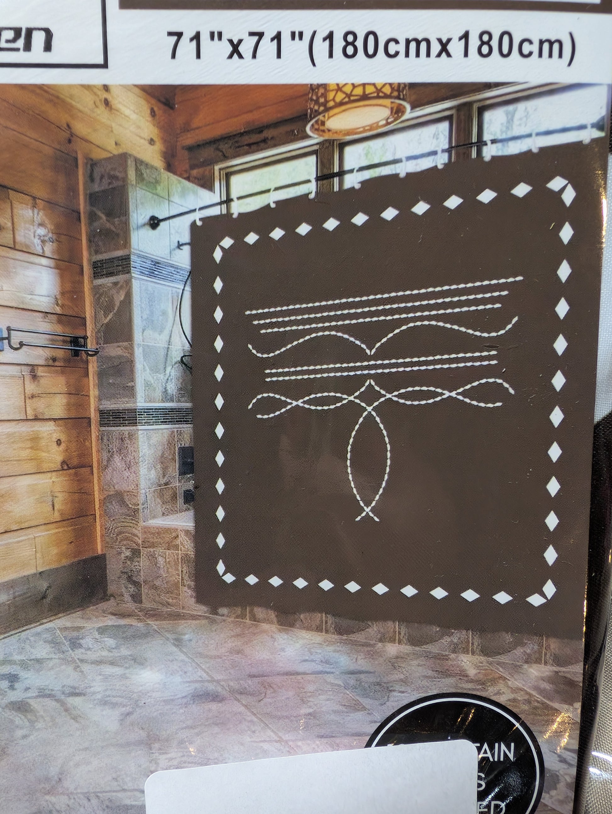 Western shower curtain with rustic Aztec patterns in earthy tones, hanging on silver rings in a farmhouse bathroom.
