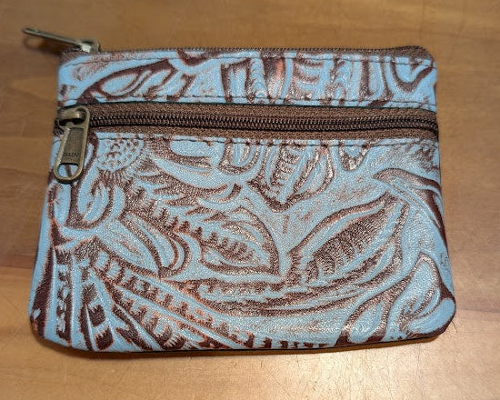 Small patterned coin purse on a wooden surface