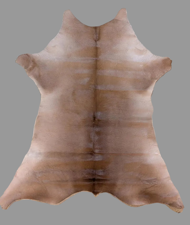 Brown Calf hide with a gray background. 